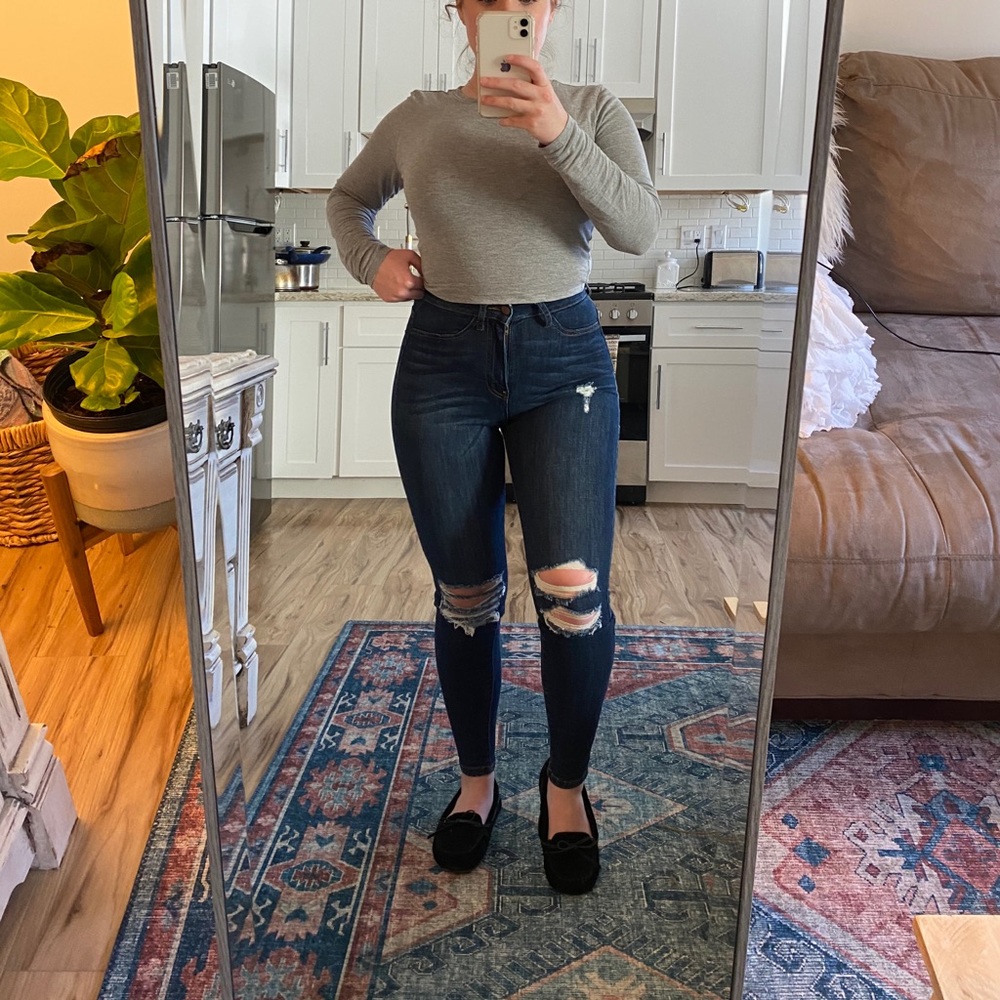 High waisted ripped blue jeans